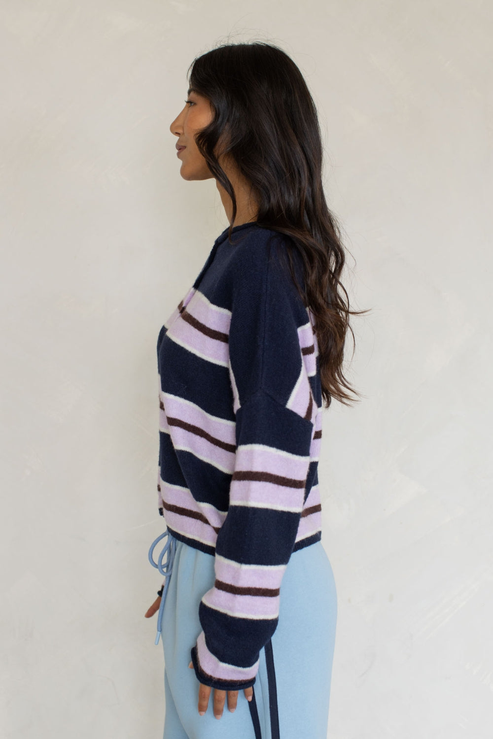 Navy striped varsity cardigan with wide lavender-pink horizontal stripes and button front