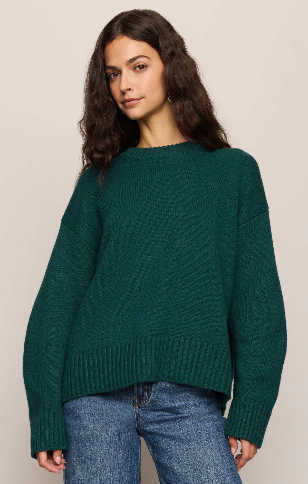 Dark green crew neck knit sweater with ribbed cuffs and hem, front view