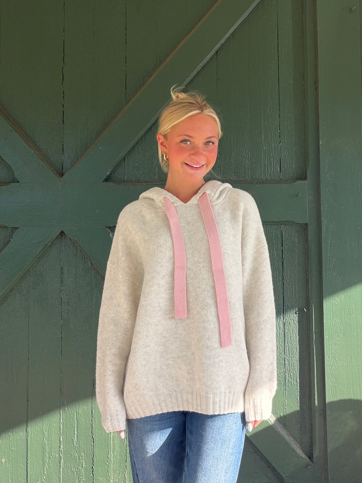 Heathered almond soft hoodie with pink drawstring ties, hood detail, ribbed cuffs