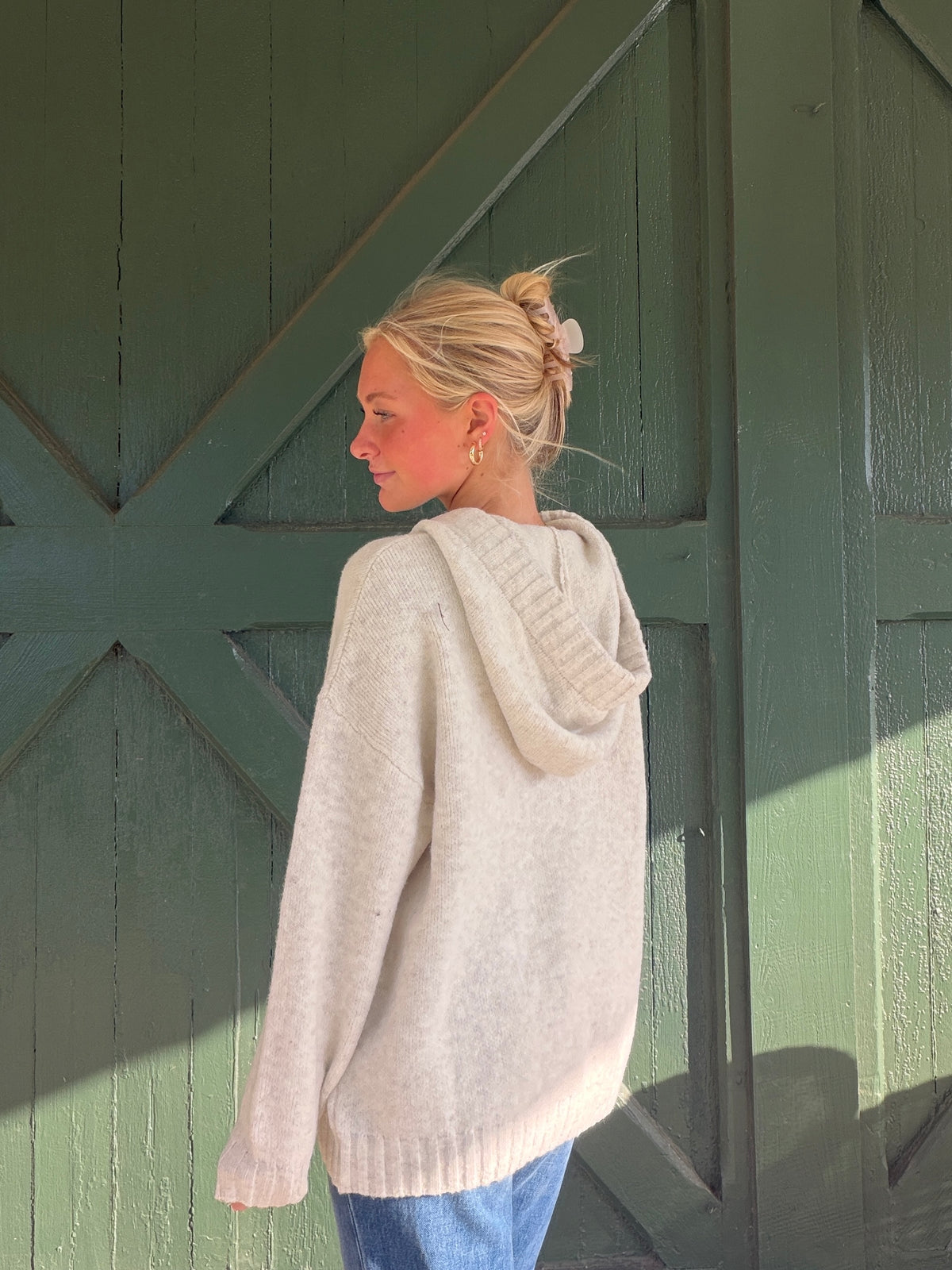 Heathered almond soft hoodie with hood and pink drawstring ties, ribbed cuffs
