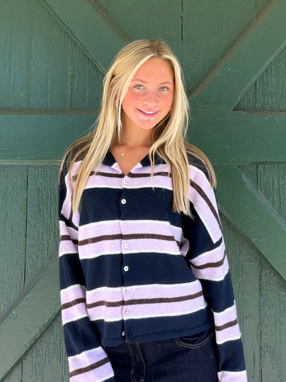 Striped knit cardigan in navy with lavender and white horizontal bands, button front