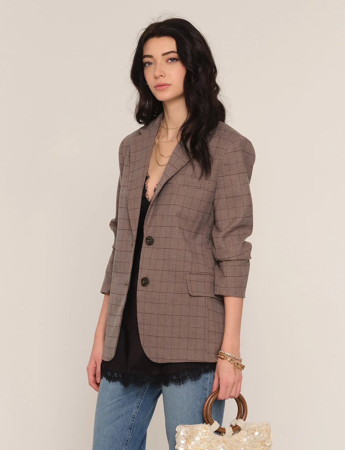 Taupe plaid blazer with button front, flap pockets, and three-quarter sleeves
