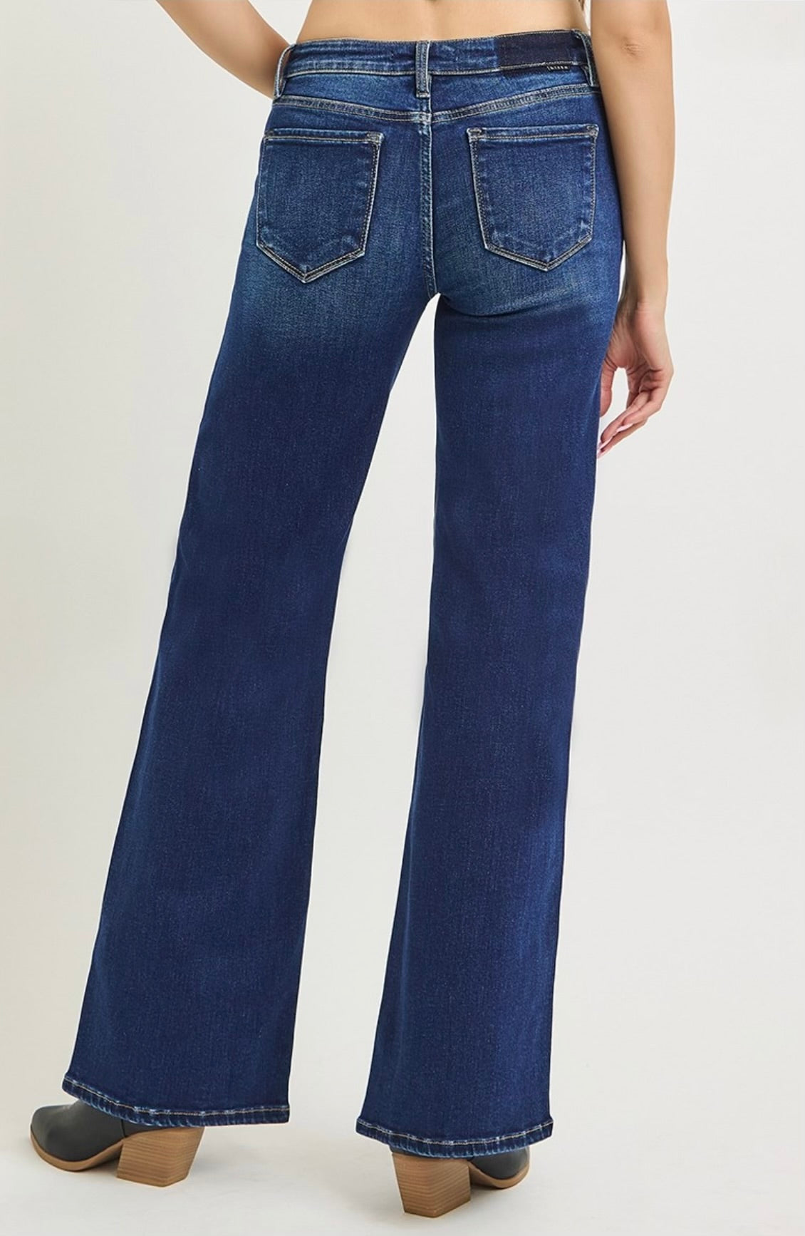 Dark blue low-rise wide-leg jeans with back pockets and button-zip closure