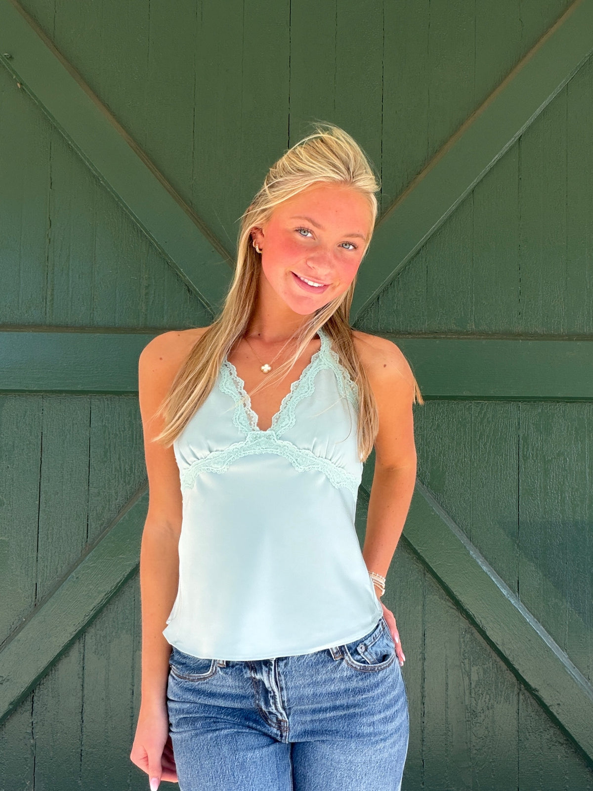 Light sage silky halter crop top with lace edge at V neckline
