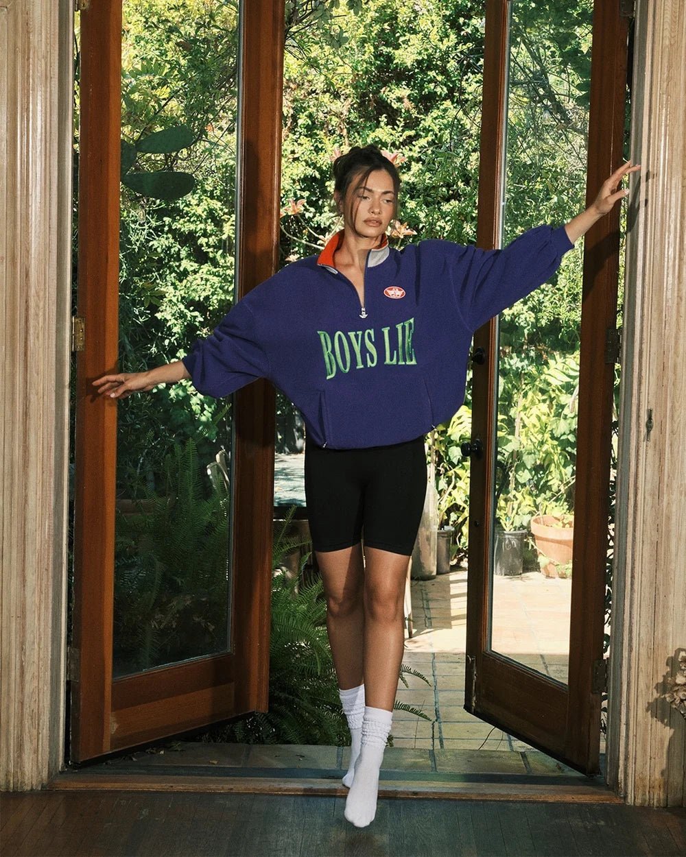 Purple quarter-zip sweatshirt with 'BOYS LIE' print, drawstring hem and red collar lining