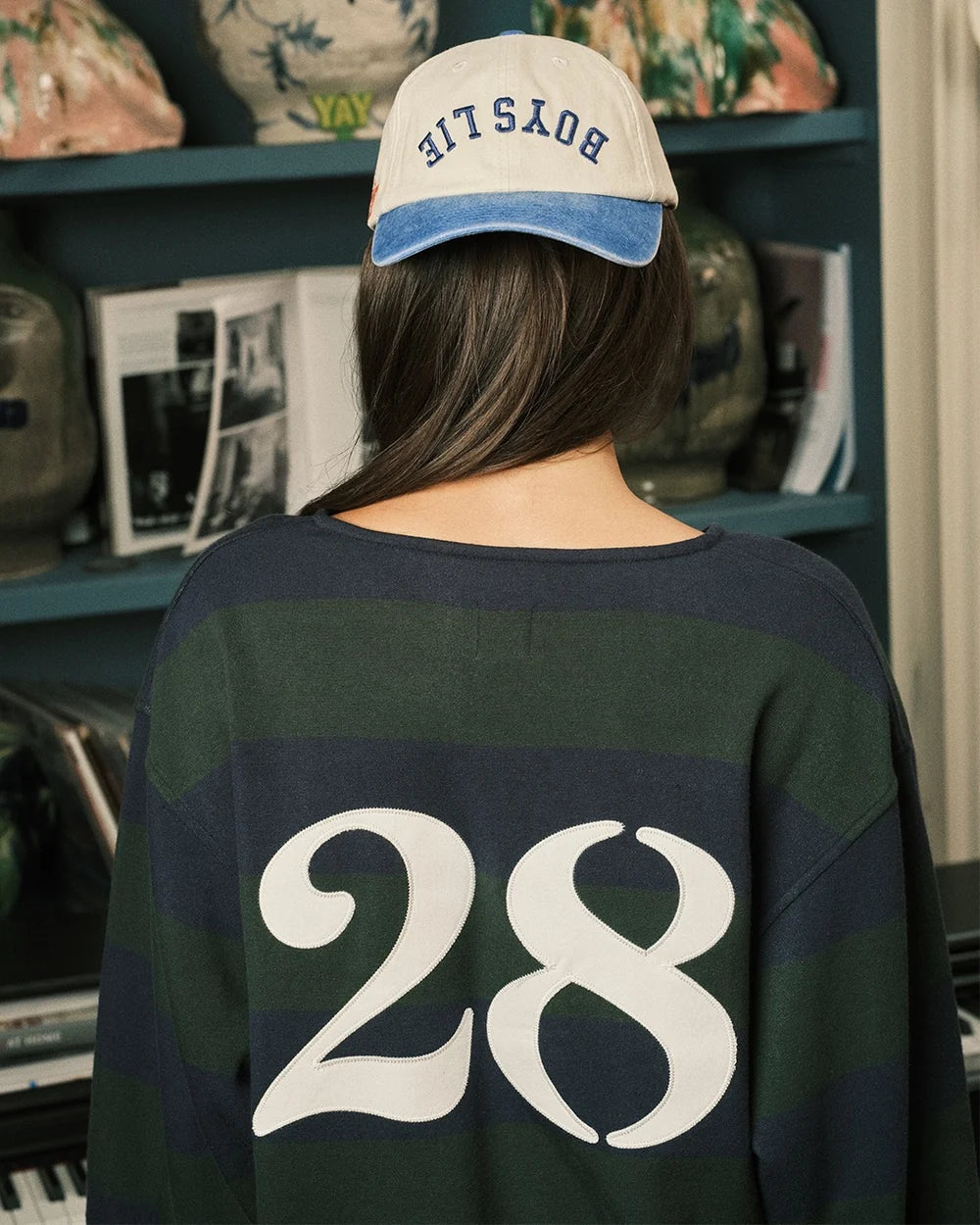 Crewneck rugby sweatshirt with navy/green stripes and large '28' back graphic