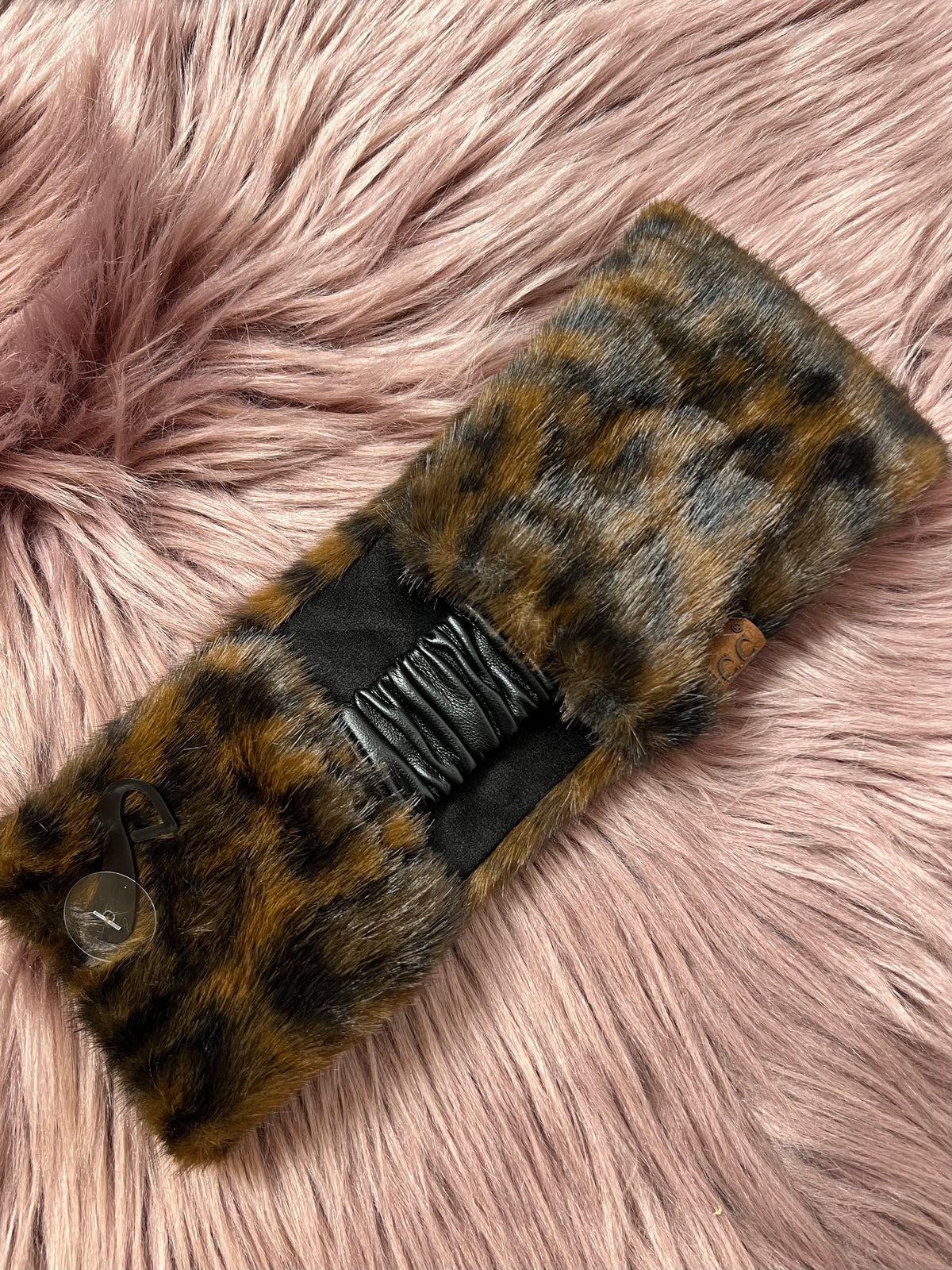 Brown leopard-print faux fur headwrap with a gathered black elastic center and button detail