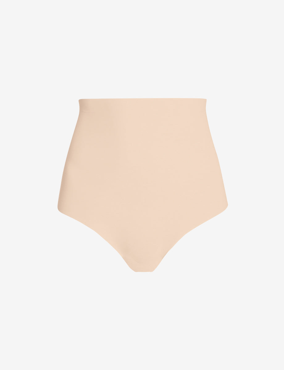 Beige control thong underwear, flat lay view with smooth seamless midsection