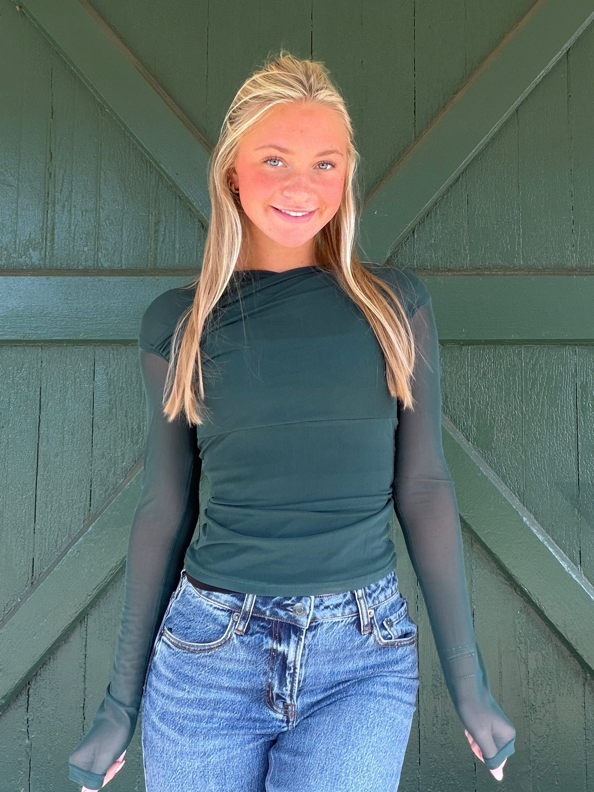Hunter green mesh long-sleeve top, fitted crew neck, front view