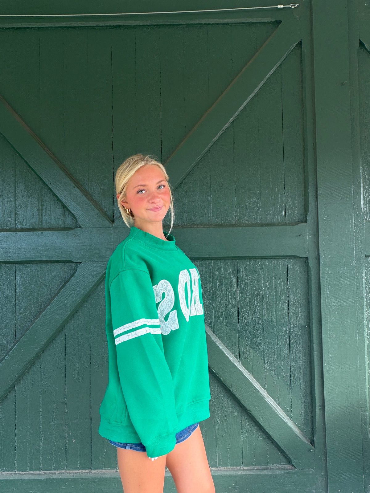 Kelly green lace mock neck sweatshirt with long sleeves and relaxed fit
