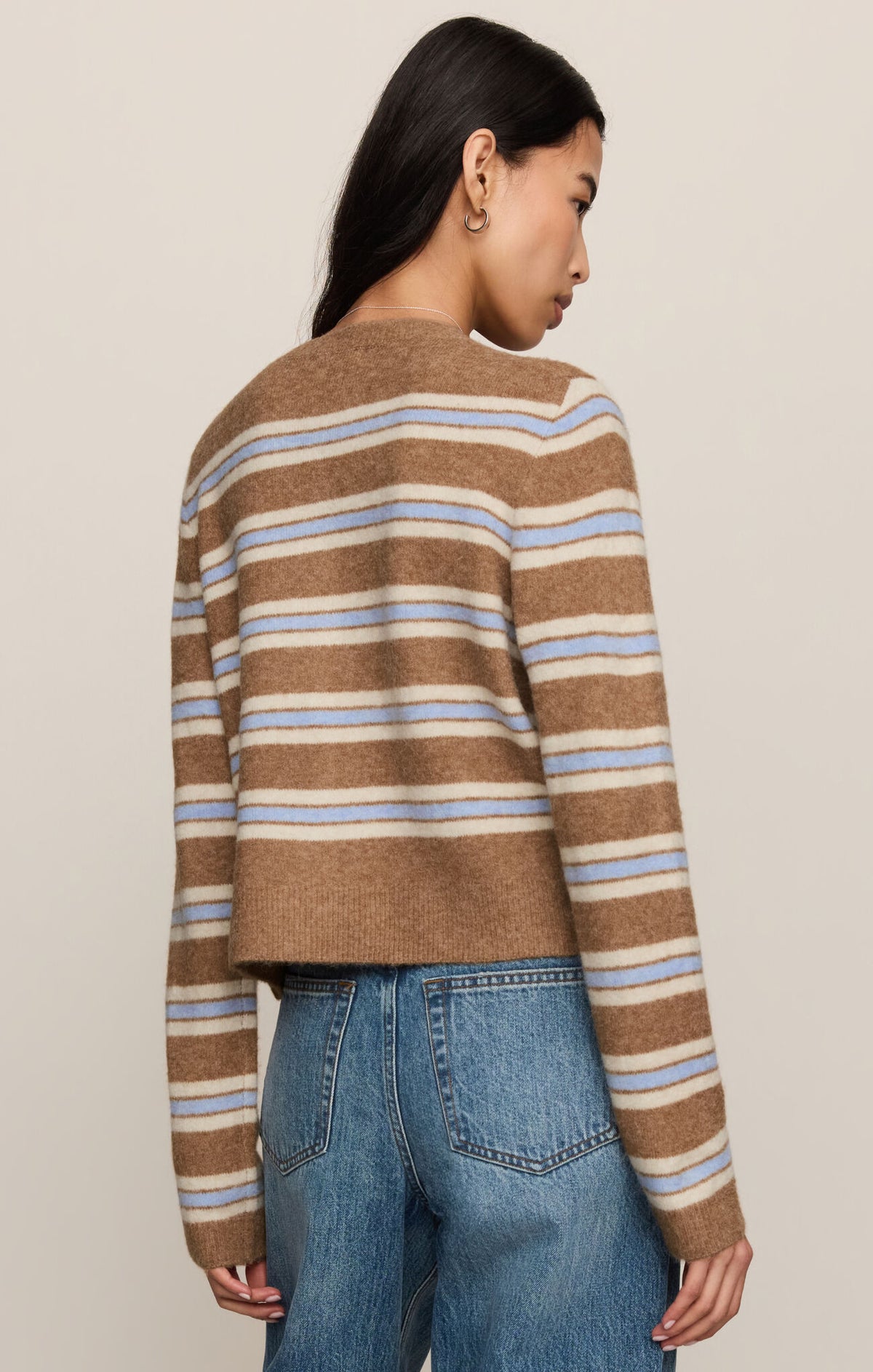 Women’s striped cardigan with button-front, showing back yoke and tan/blue/white stripes
