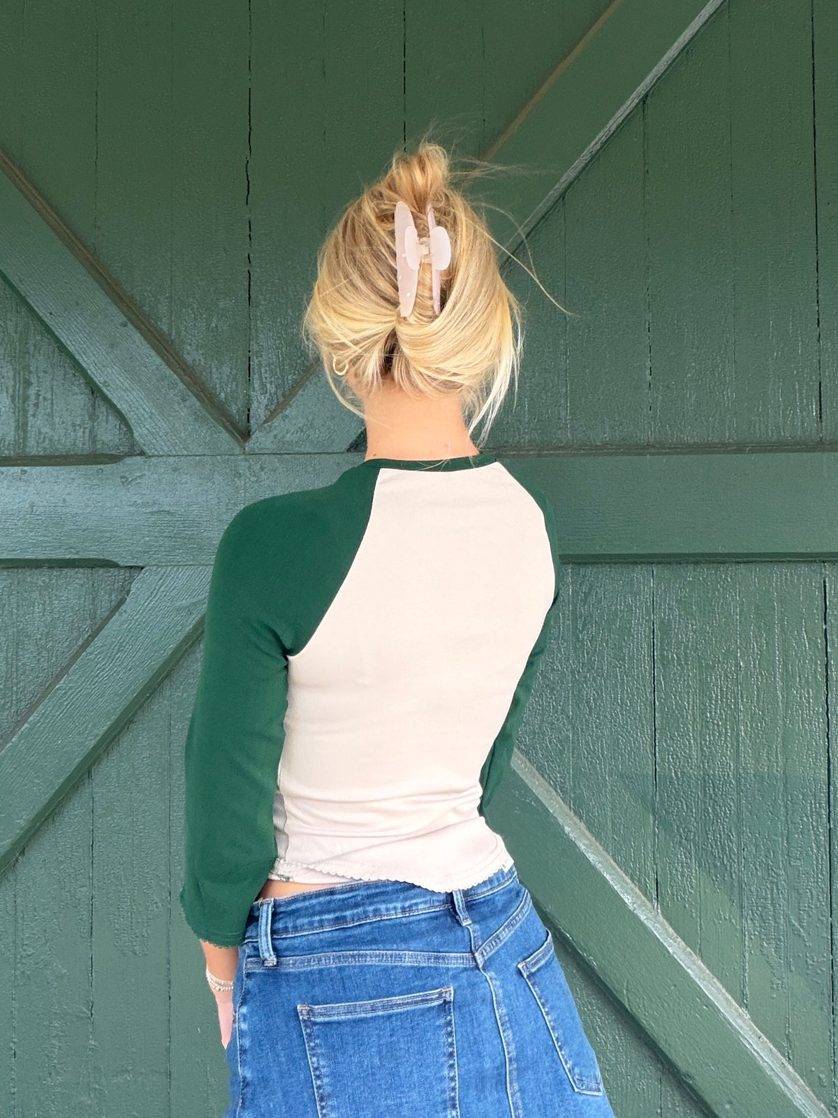 Green and white 3/4 sleeve baseball tee with raglan sleeves, back view.