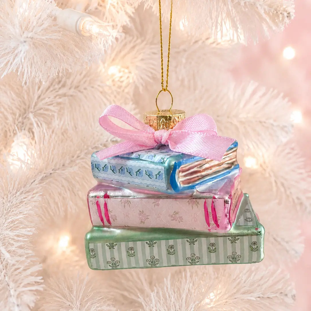 Library books ornament with pink bow and gold hanging loop, blue and green painted covers