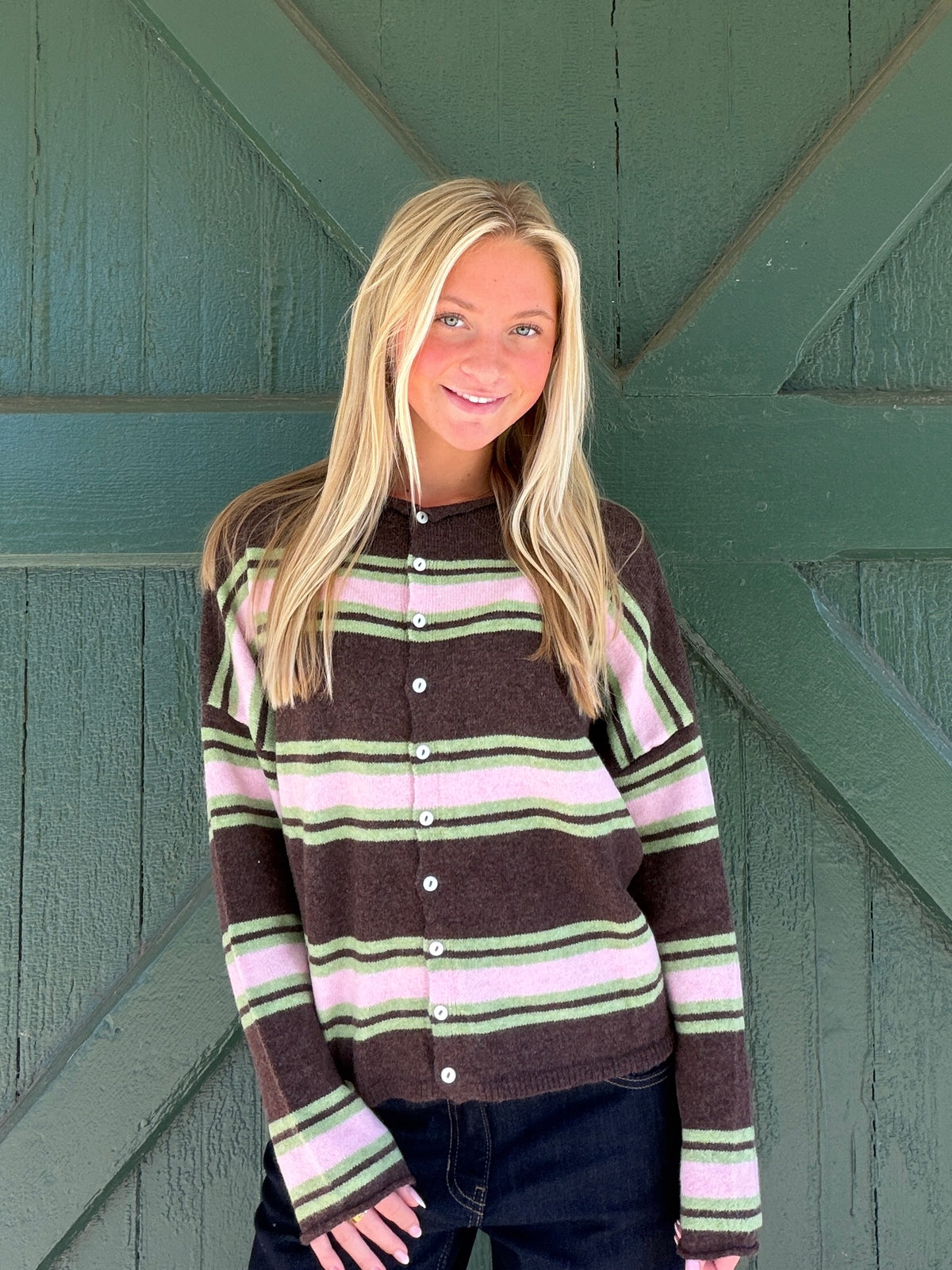Chocolate multicolor varsity stripe cardigan, front button placket and striped crew neckline.