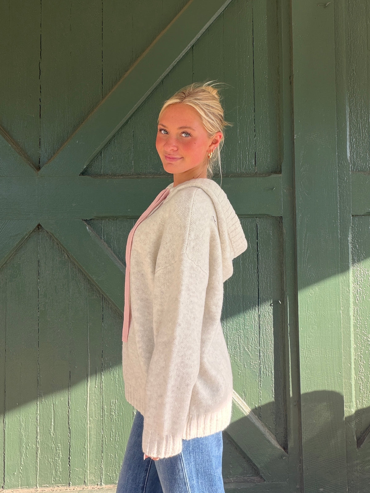 Heathered almond soft hoodie with hood and pink drawstring ties, ribbed hem