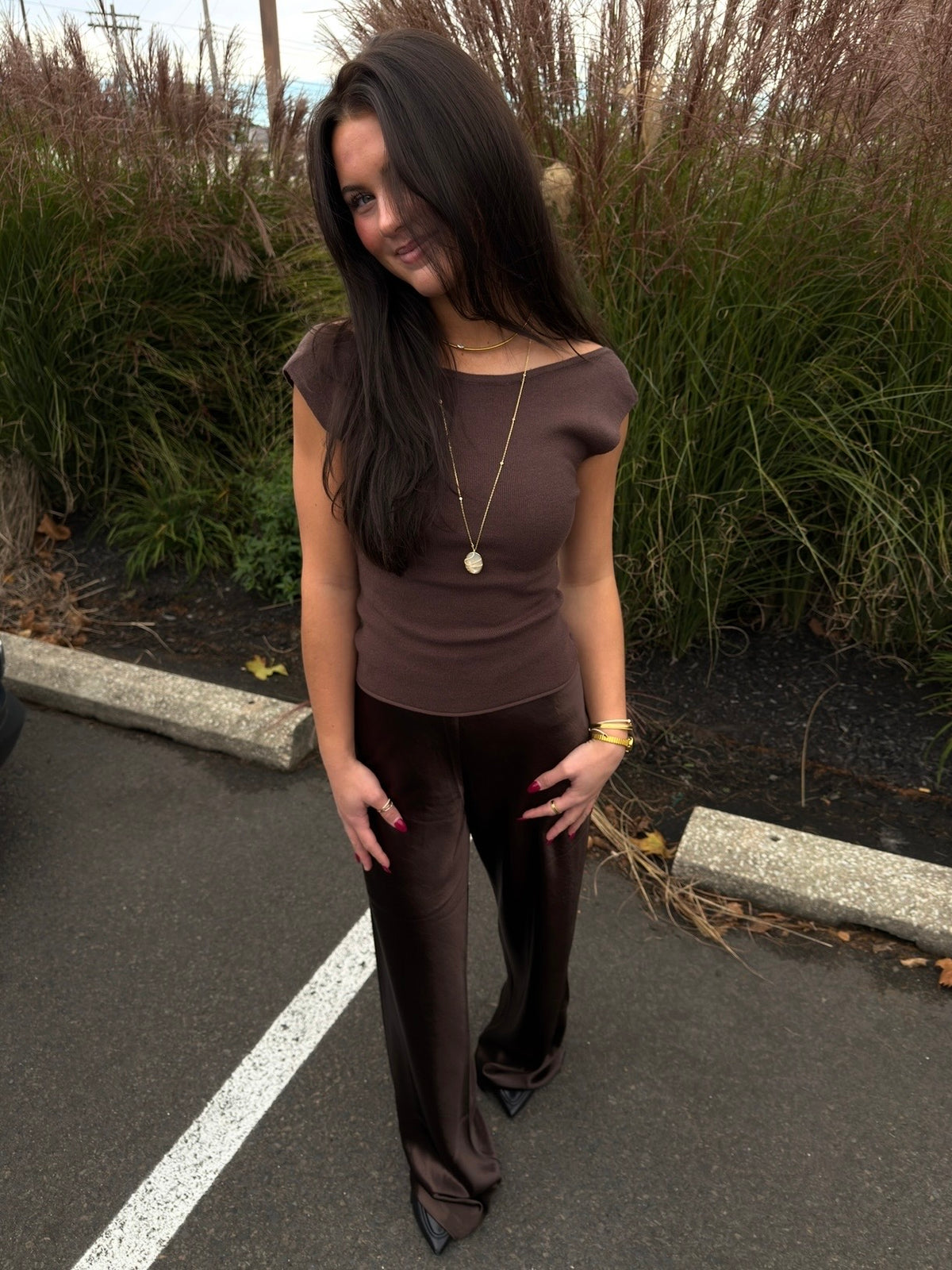 Brown satin bias pants with draped legs and flared hem