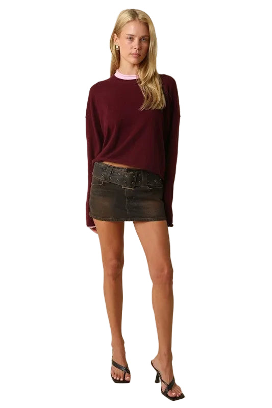 Wine red knit sweater with pink contrast collar and cuff trim