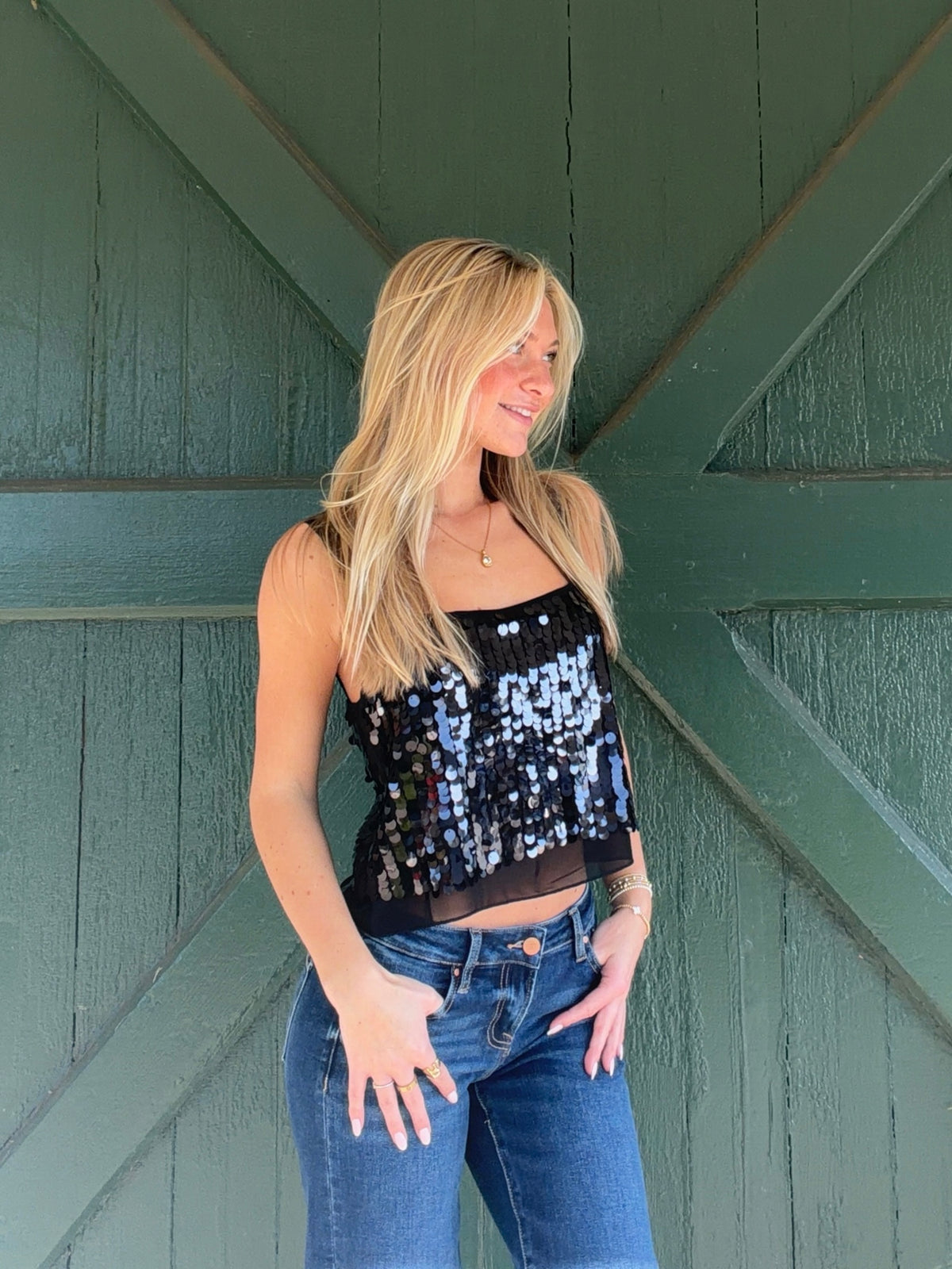 Lucy Paris Clara cropped top with black and iridescent sequins, shown from the front at an angle