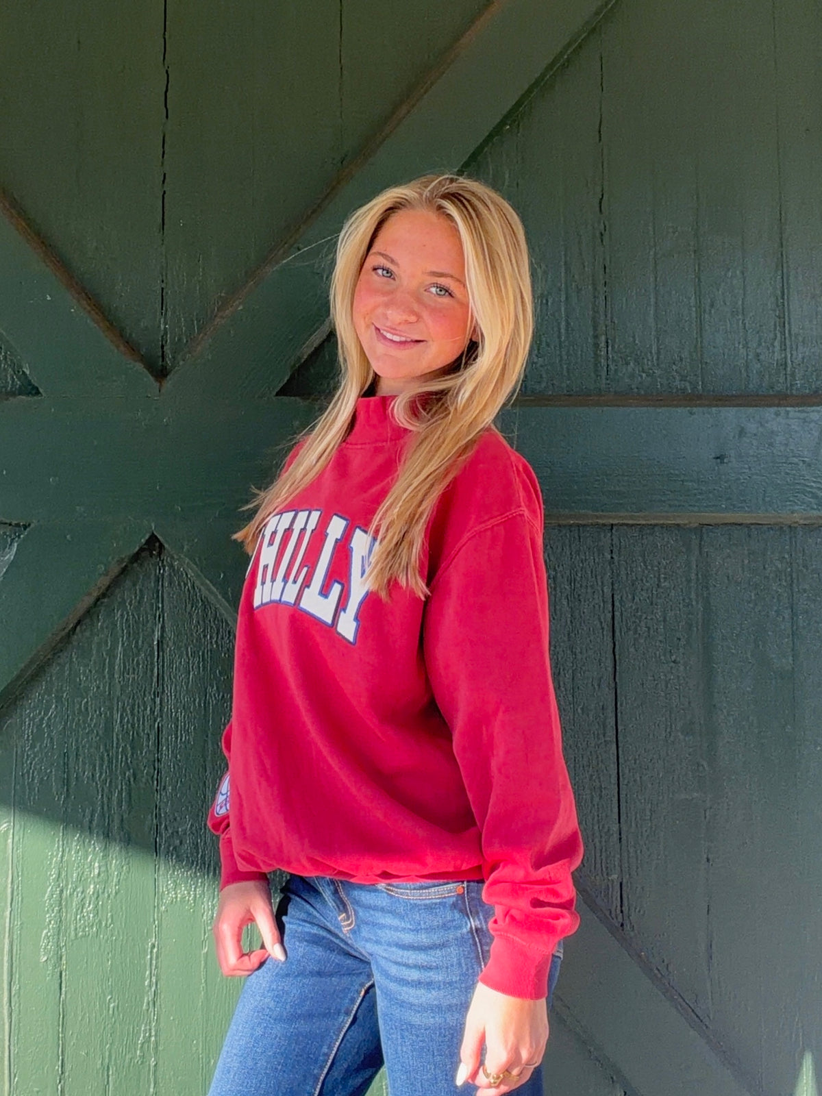Red PHILLY mock-neck sweatshirt with ribbed cuffs and hem, shown from the front at an angle