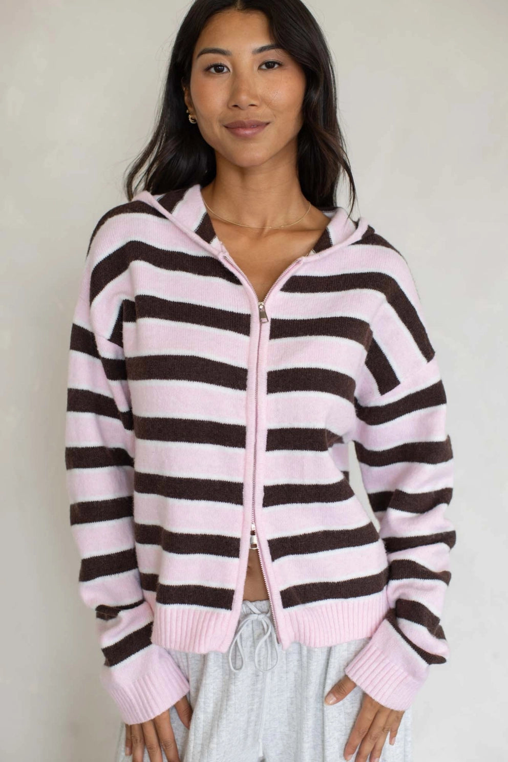 Multi-stripe zip sweater hoodie with hood, front zip and ribbed cuffs.