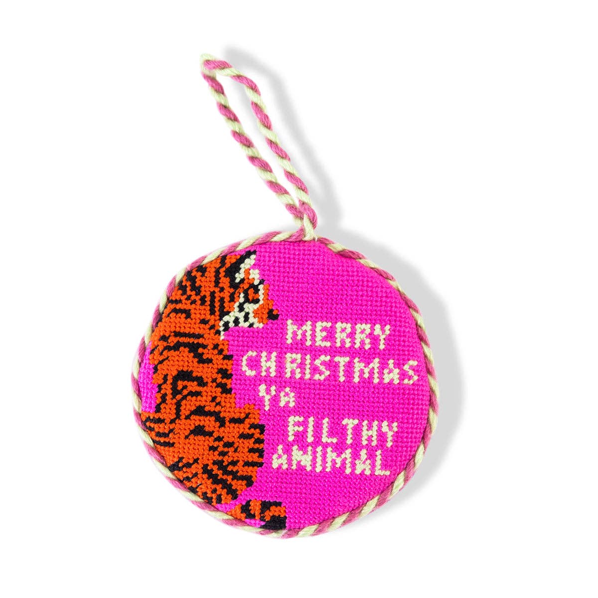 Needlepoint Christmas ornament ball with pink and orange stitched text “MERRY CHRISTMAS FILTHY ANIMAL”